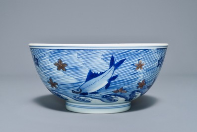 A rare Chinese blue and underglaze red bowl with carps and marine animals, Xuande mark, Kangxi